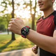 Person wearing smartwatch during outdoor fitness activity
